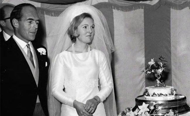 Mary Berry and her husband Paul on their wedding day with their wedding cake 