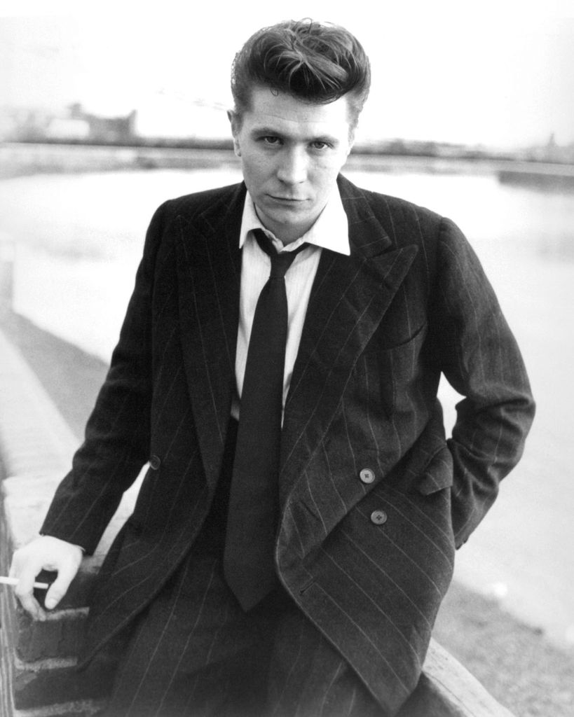 Black-and-white photo of Gary Oldman in a suit