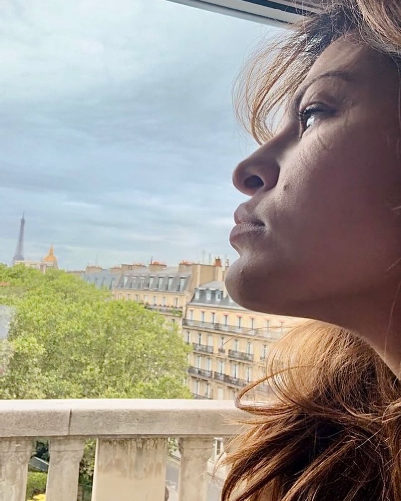 Eva Mendes shares a selfie from her hotel room in Paris looking out at the skyline, shared on Instagram