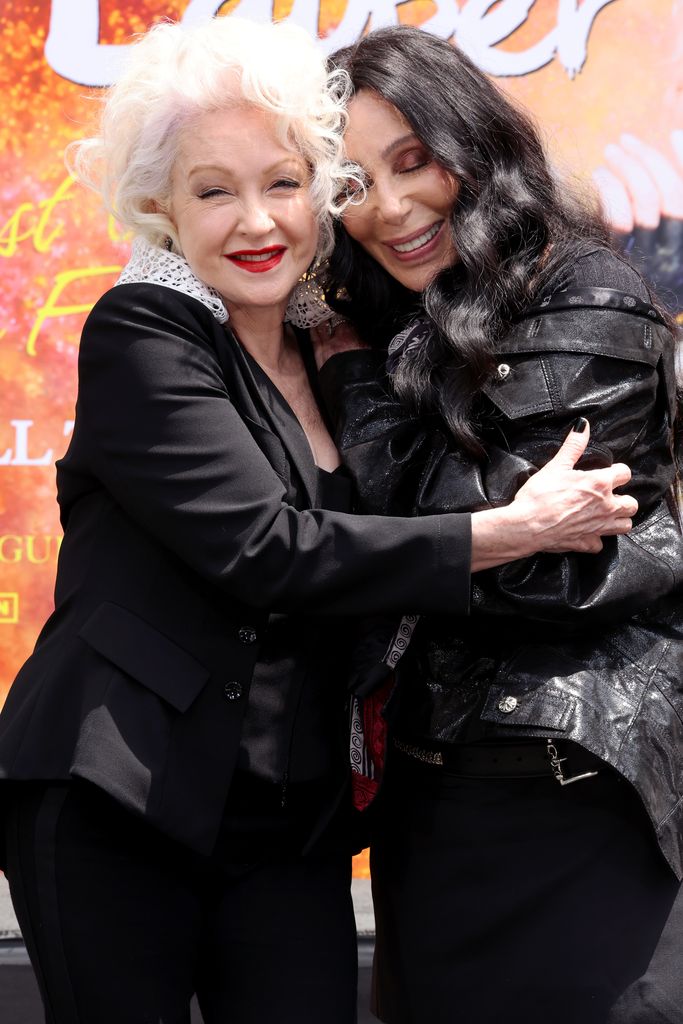 HOLLYWOOD, CALIFORNIA - JUNE 04: (L-R) Cyndi Lauper and Cher attend the Cyndi Lauper Hand and Footprint in Cement Ceremony at TCL Chinese Theatre Hollywoodat TCL Chinese Theatre on June 04, 2024 in Hollywood, California. (Photo by Amy Sussman/Getty Images)