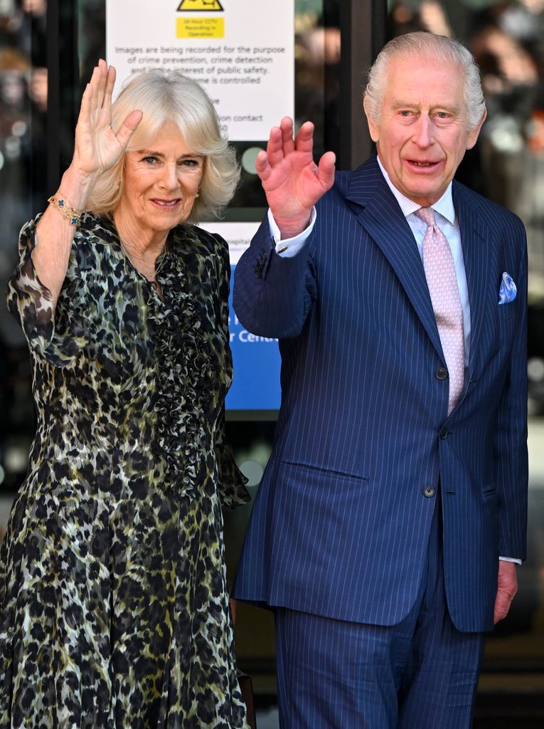 King Charles and Queen Camilla wave