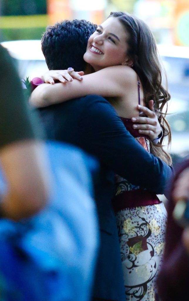 Suri embraced her friend outside ahead of the prom 