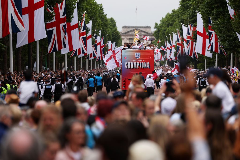 The England bus makes its way down The Mall during the England Women's team victory parade