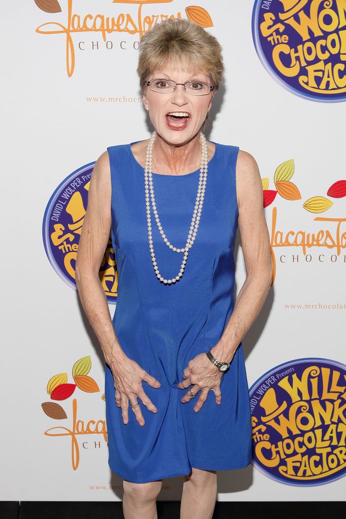 Denise Nickerson in a blue dress and pearl necklaces
