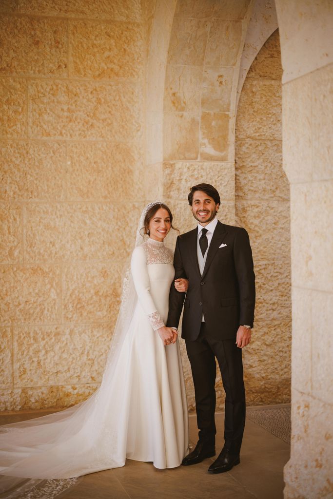 Princess Iman in a white wedding dress and Jameel Alexander Thermiotis in a black suit