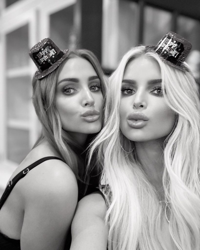 Jessica Simpson (right) poses for selfie with sister Ashlee with both wearing mini top hats 