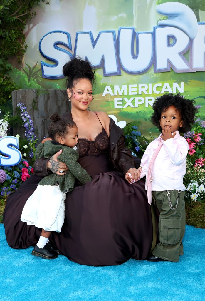 Rihanna knelt down with her two sons