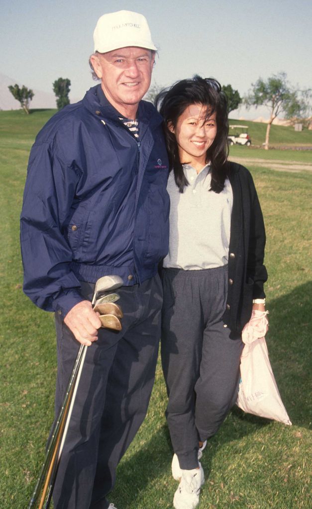 Gene Hackman and Betsy on a golf course