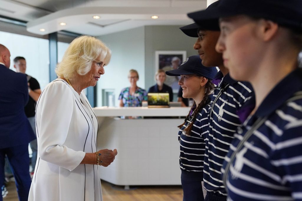 Queen Camilla meets ball boys and girls at Wimbledon