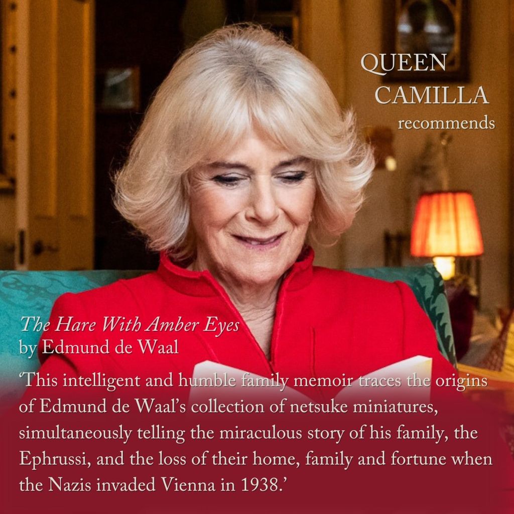 Queen Camilla reading in a red dress