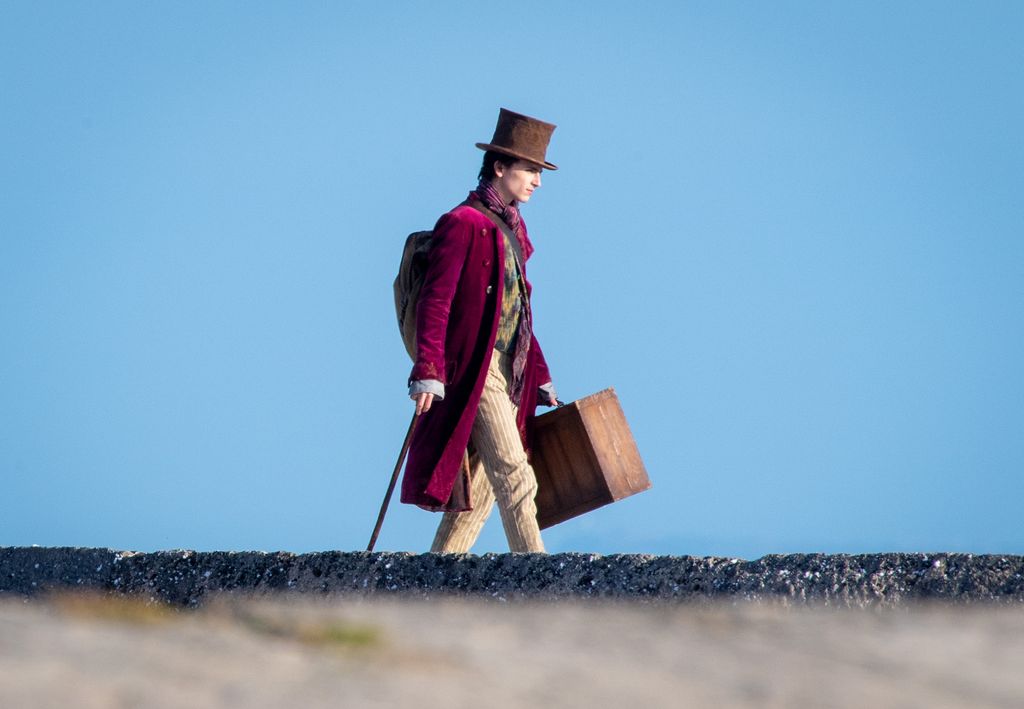 Timothée Chalamet is seen as Willy Wonka during filming for the Warner Bros and the Roald Dahl Story Company's upcoming movie 'Wonka' on October 11, 2021, in Lyme Regis, England. This film will focus on the young Willy Wonka on his earliest adventure and how he met the Oompa-Loompas. (Photo by Finnbarr Webster/Getty Images)