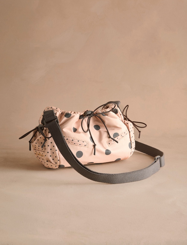 pink bag with ruched detailing and black dots