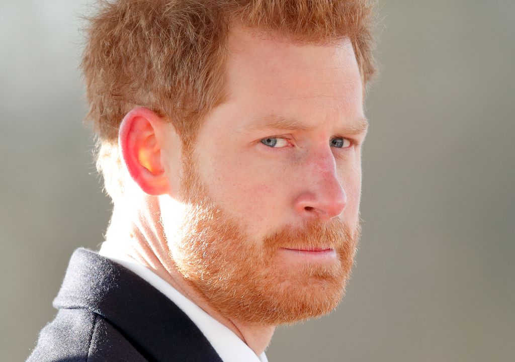 Prince Harry looks serious in the sun