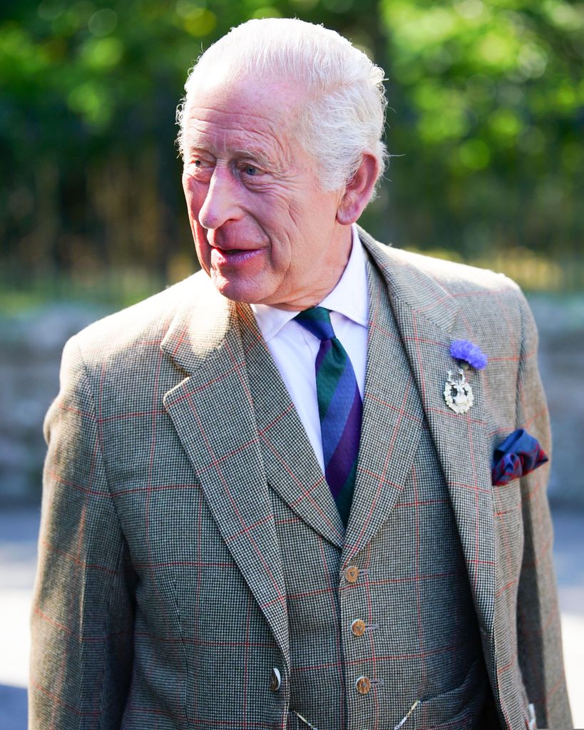 King Charles in tweed jacket and striped silk tie