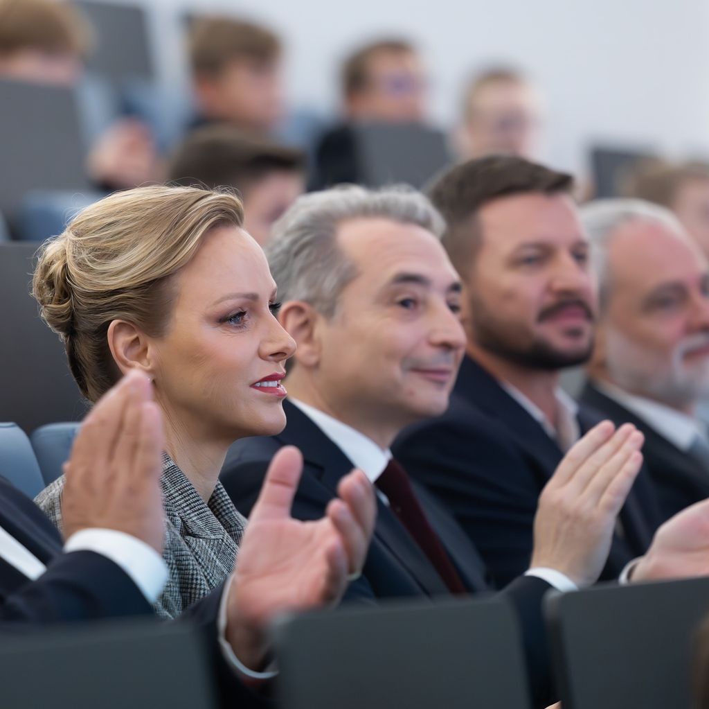 princess charlene side on with bun in her hair
