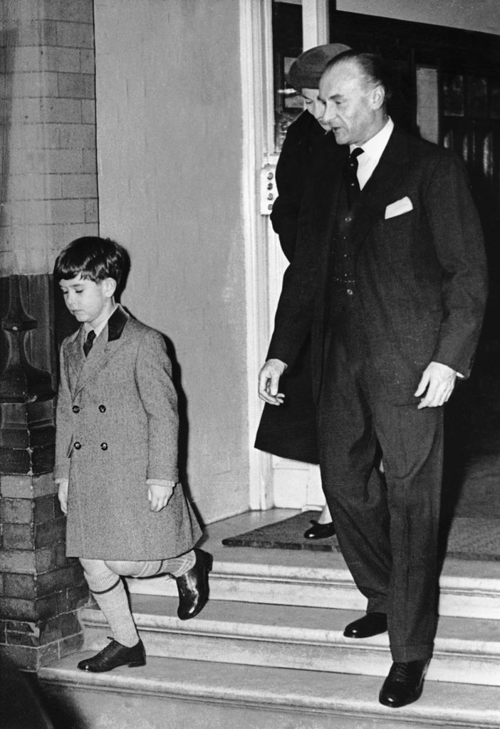 A young King Charles walking with a headmaster