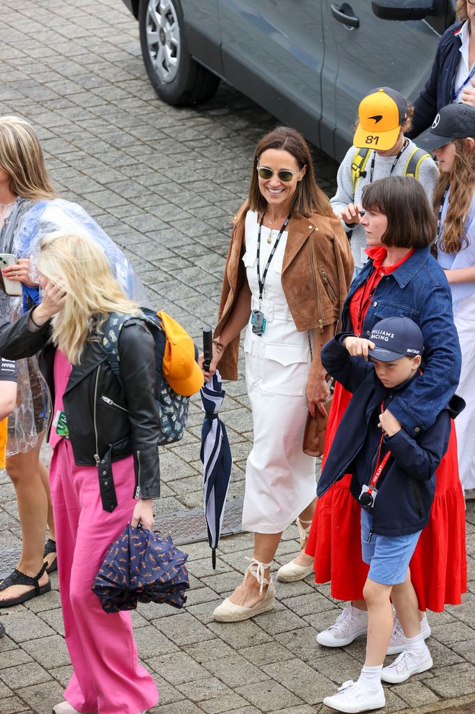 Pippa Middleton in white dress with people