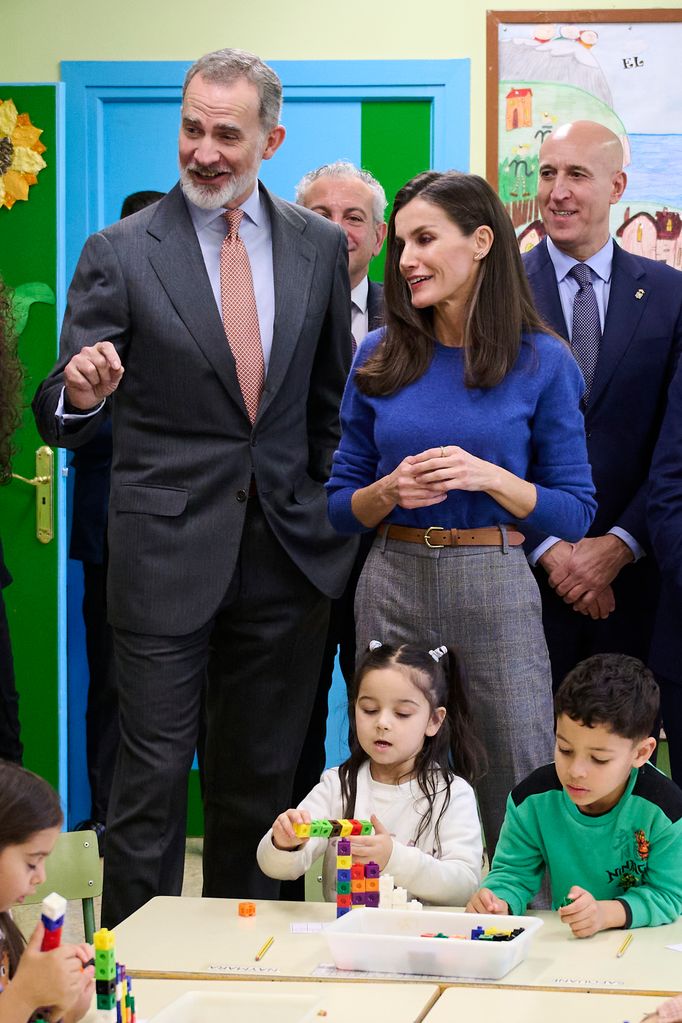 King Felipe and Queen Letizia in a classroom with staff and children