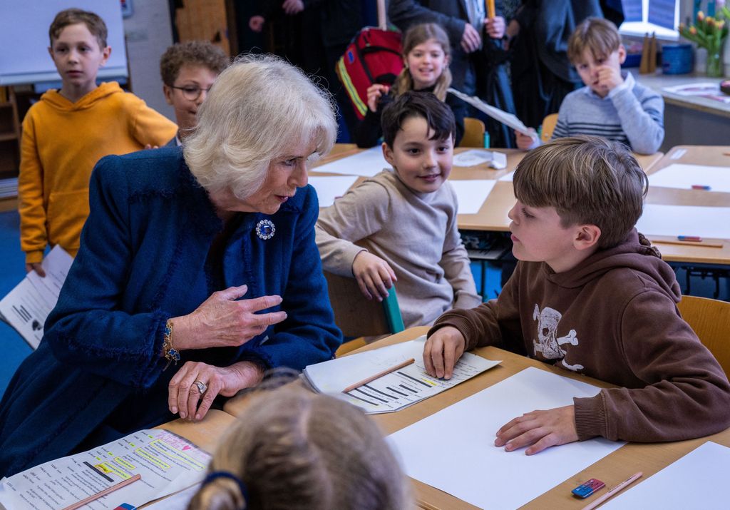 Queen Consort Camilla chatting to a little boy in Germany 