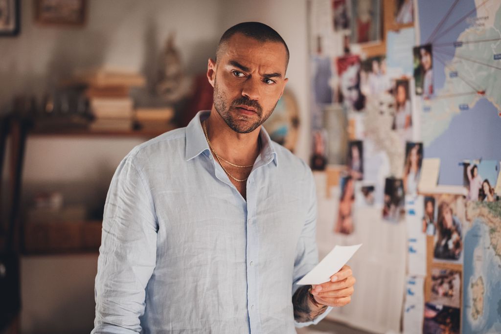 man holding piece of paper in flat