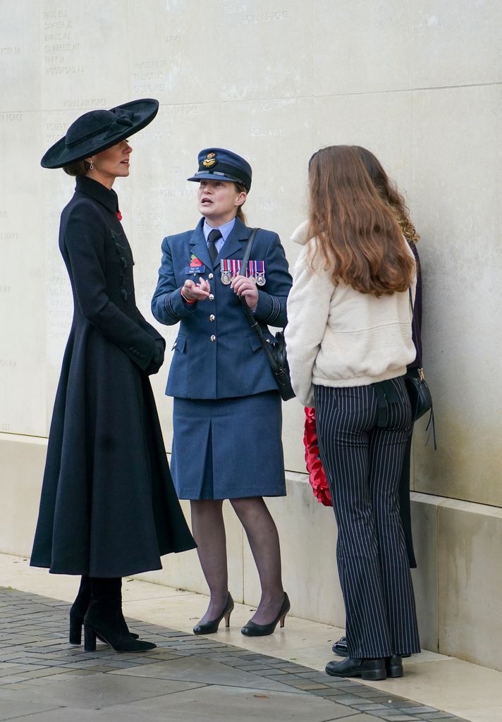 Princess Kate speaks to Beth Long and her daughters Scarlett and Sophie as she attends the Armistice Day Service of Remembrance