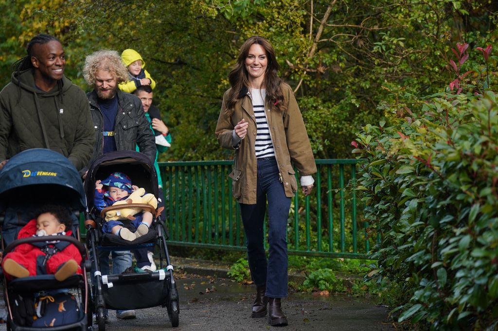 The Princess of Wales donned denim jeans and a striped top to join a Dad Walk in the local park during a visit to "Dadvengers"
