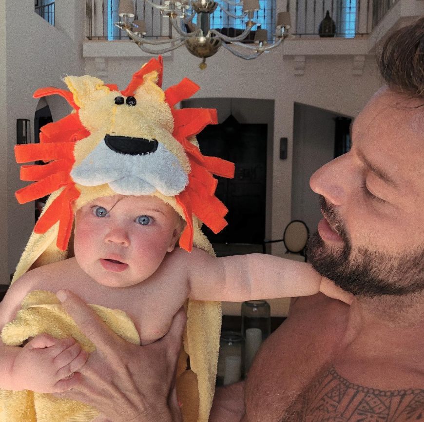 Ricky Martin with daughter in lion onesie