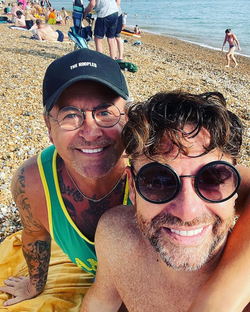 Stephen and Daniel take selfie on the beach