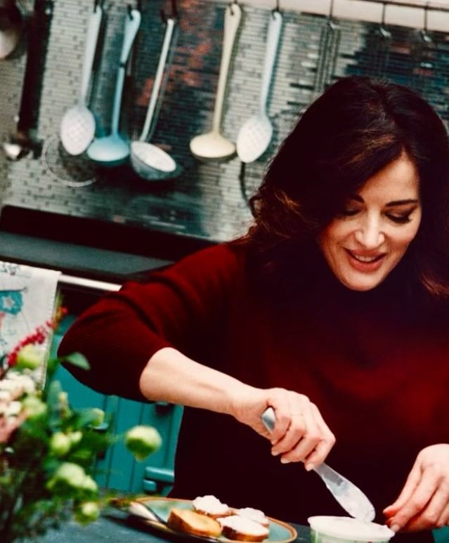 Nigella Lawson cooking in her kitchen