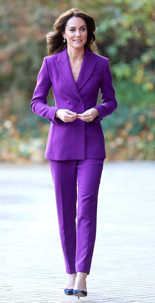 Kate arrives at the Design Museum wearing purple trouser suit