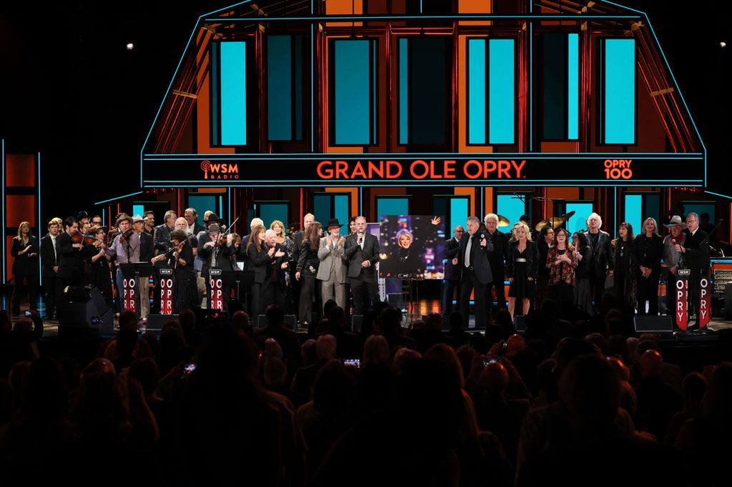 Artists, musicians, and Grand Ole Opry members sing onstage at A Public Celebration of Life 