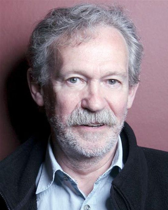 head shot close-up man grey beard