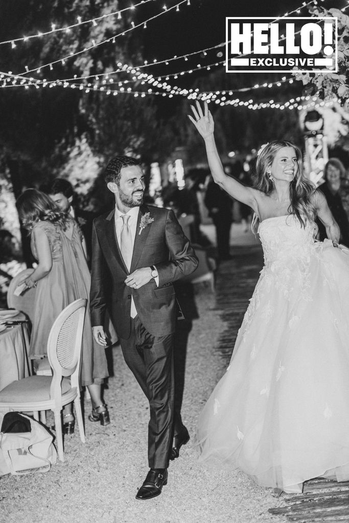Bernardo Silva and Ines walk out of their wedding reception