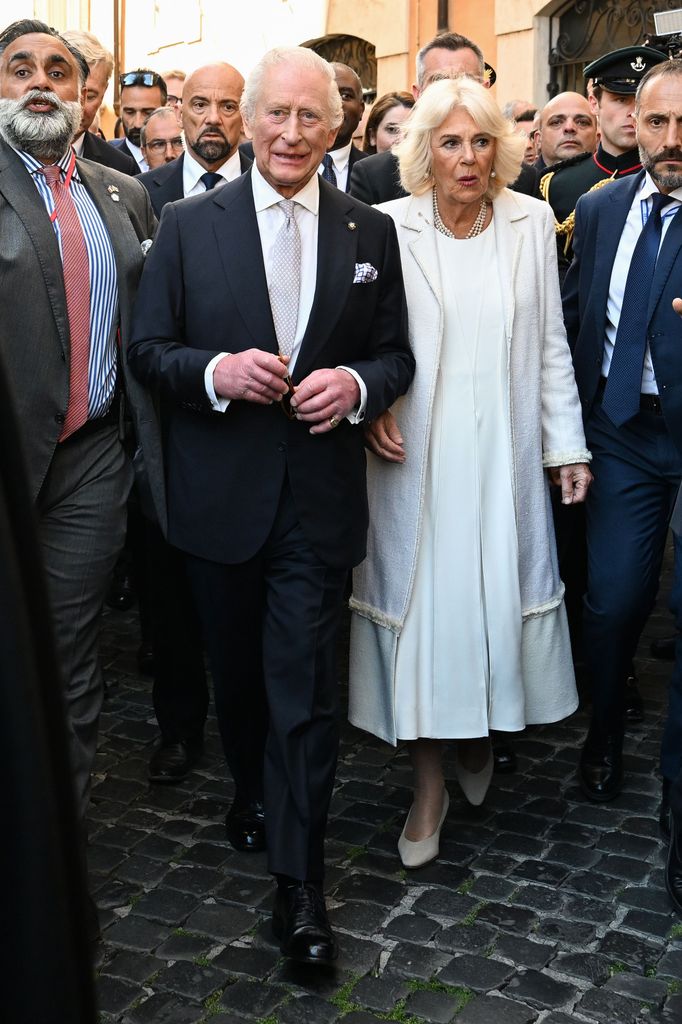 king charles and queen camilla walking through Rome