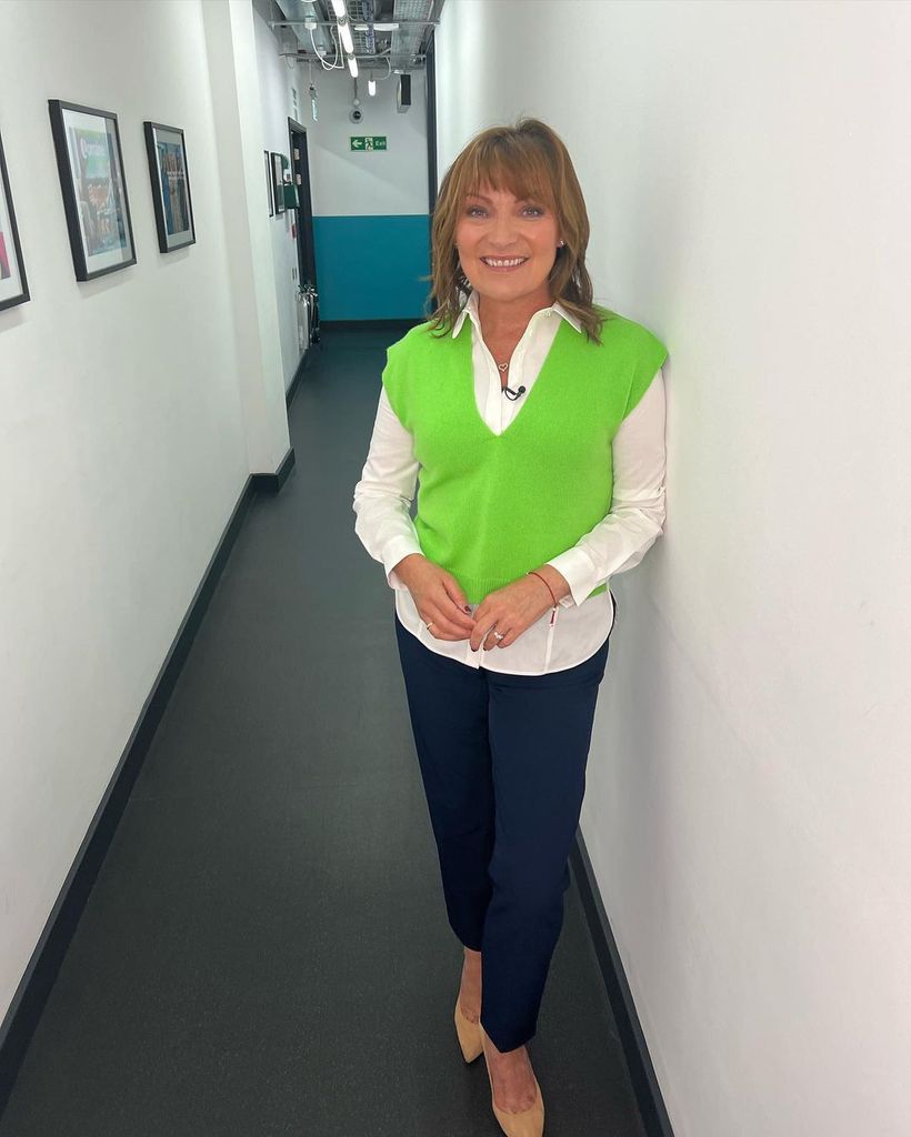 Lorraine Kelly wearing green vest and white shirt backstage at ITV