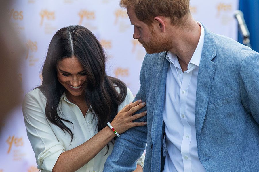 meghan markle laughs hold on to harry
