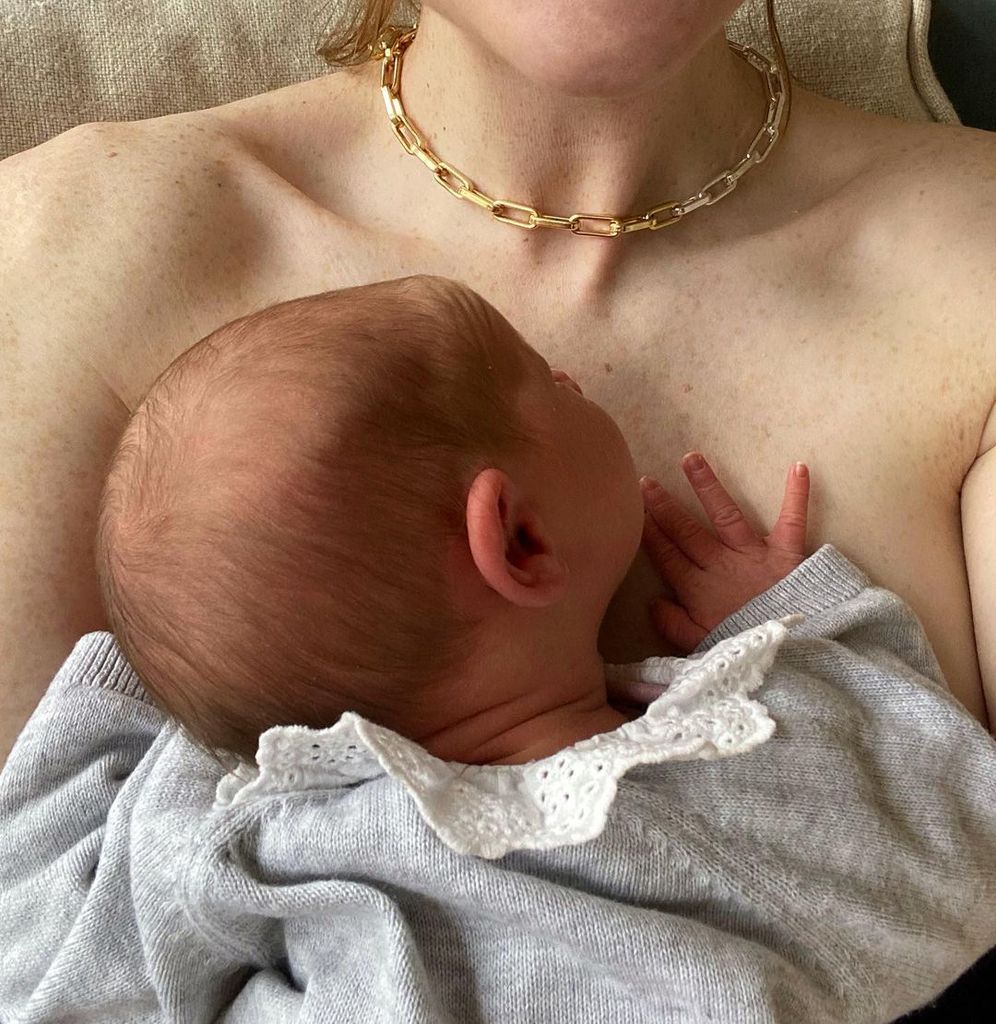 Angela cradling baby daughter Marnie