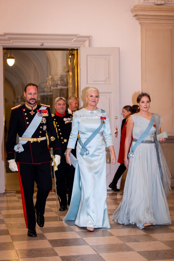 Crown Princess Mette-Marit in blue with Prince Haakon and Princess Ingrid at gala