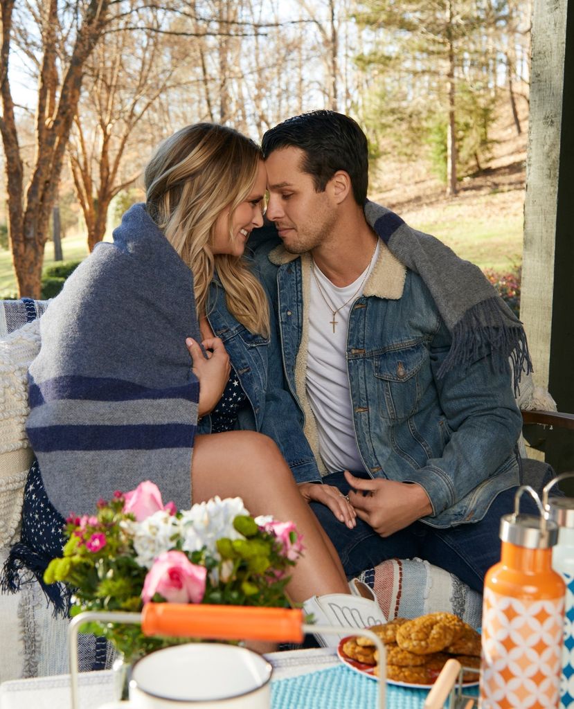 photo of miranda lambert and brendan mcloughlin sitting together on porch