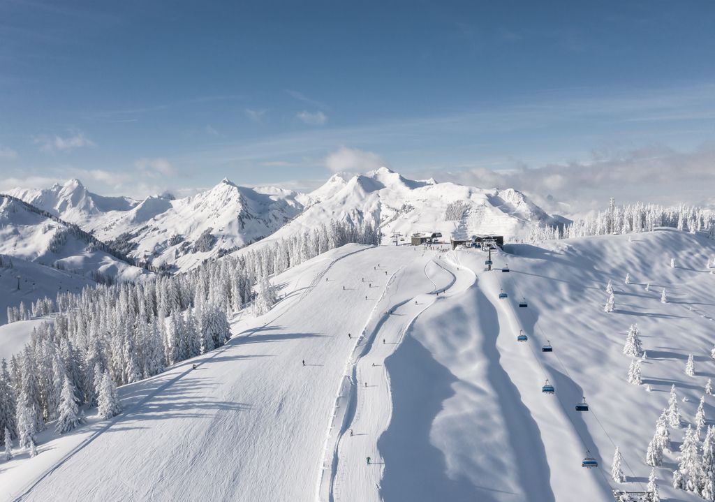 Leogang Austria mountain view of pistes on sunny day