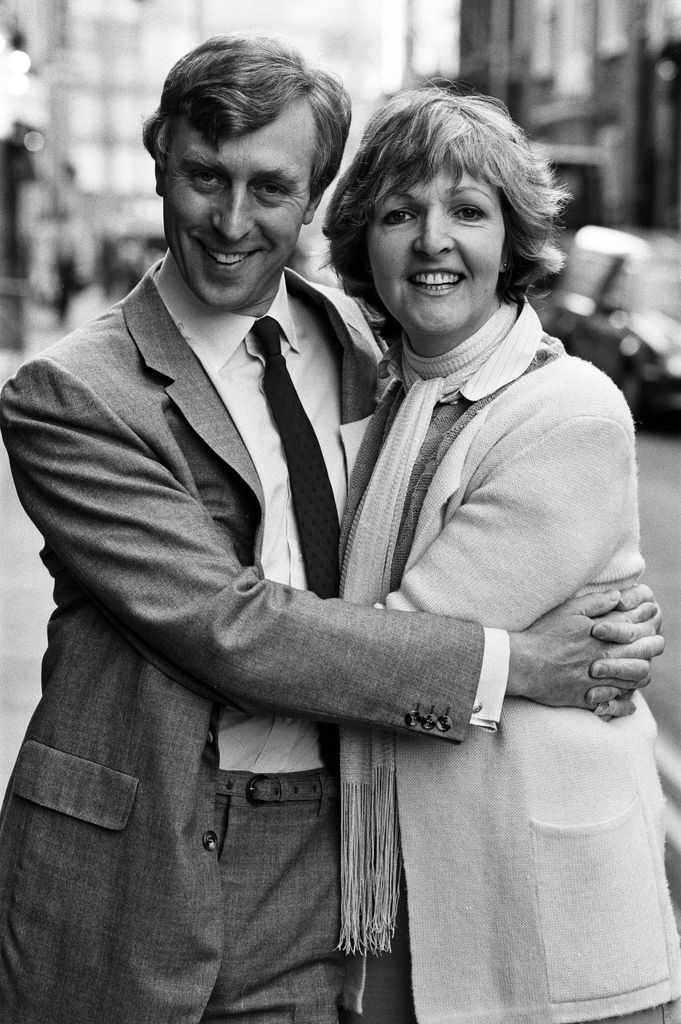 couple hugging outside theatre