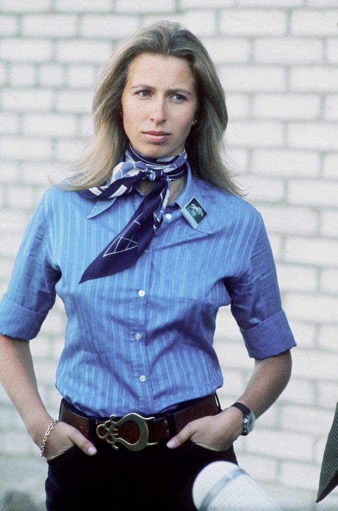 Princess Anne in a blue striped shirt with long hair