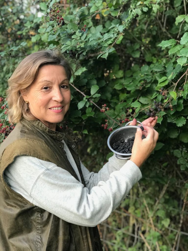 Rebecca Pow MP harvesting berries in garden