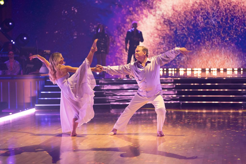 Andy Richter and Emma Slater perform during Rock and Roll Hall of Fame Night on Dancing with the Stars