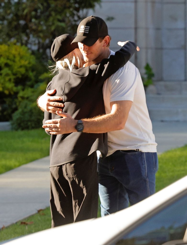 Chris Pratt hugs his ex-wife Anna Faris as they dropped off their son to Jack to help feed the homeless on Thanksgiving.