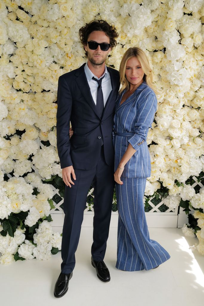 Sienna Miller and Oli Green , wearing Ralph Lauren, attends the Polo Ralph Lauren & British Vogue event during The Championships, Wimbledon at All England Lawn Tennis and Croquet Club on July 09, 2023 in Wimbledon, England. (Photo by Darren Gerrish/WireIm