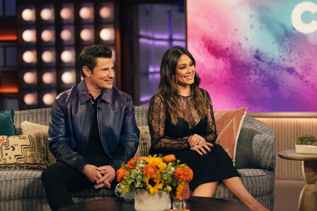 Nick and Vanessa Lachey sat on a sofa together 