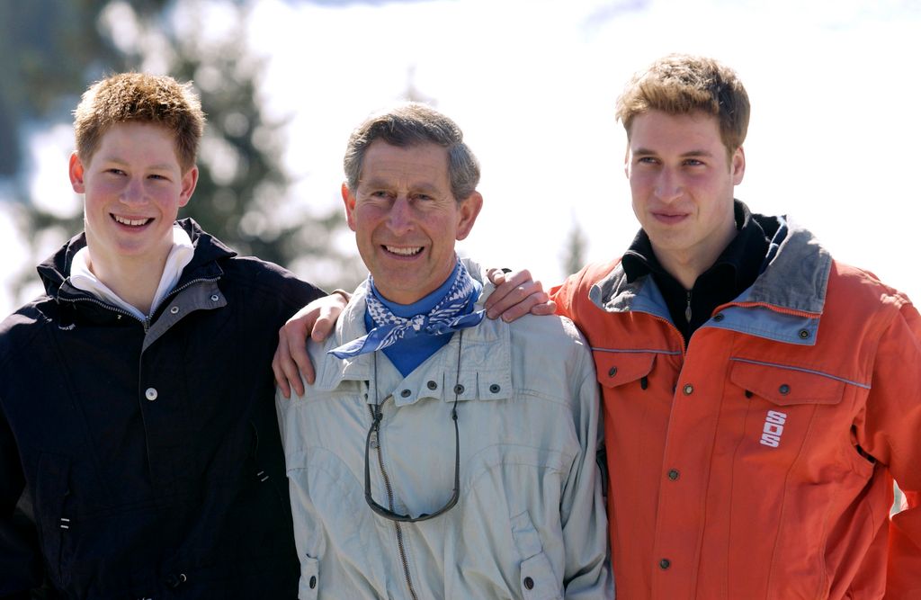 Prince Harry, King Charles and Prince William all smiling while on a ski holiday