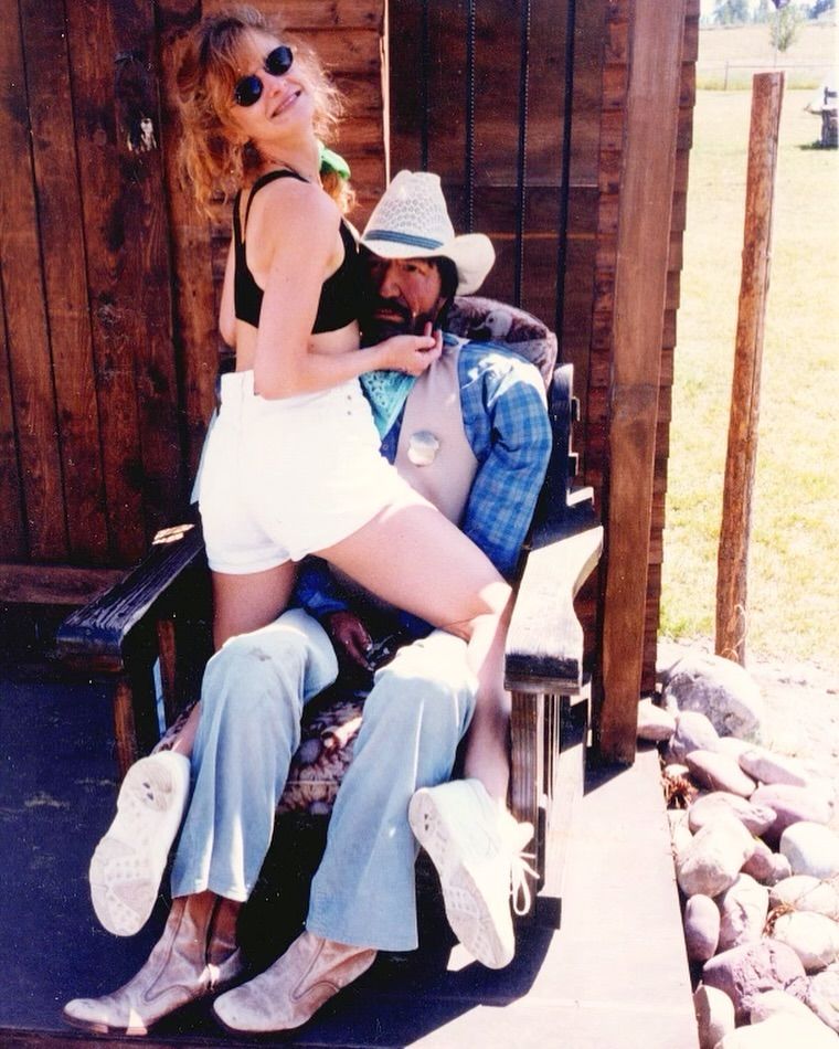 Kyra Sedgwick in a fun throwback photo with a mystery cowboy on the set of Kevin Bacon's film Tremors 