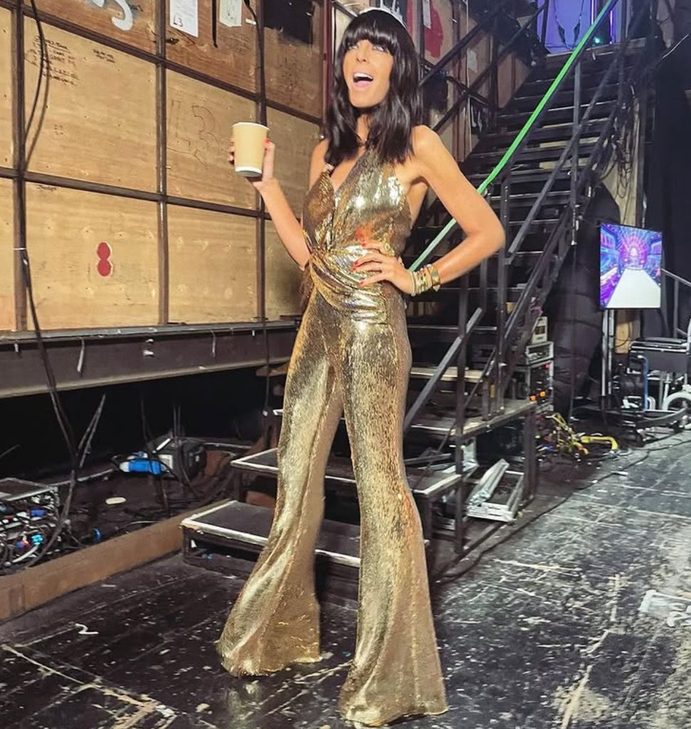 Claudia Winkleman wearing a gold jumpsuit from Nadine Merabi on Strictly Come Dancing